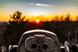 selective focus photo of silver tower viewer telescope facing sunshine by Matt Noble courtesy of Unsplash.